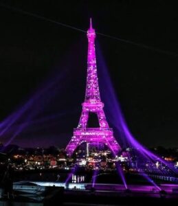 Student Life in Paris: The French Effect on My Growth Abroad Eiffel Tower glowing pink for Pink October in Paris at night